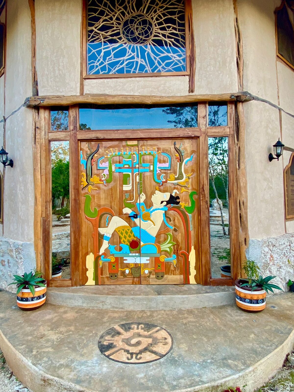A hand-painted wooden door in deep jade green — a detail of local craftsmanship.